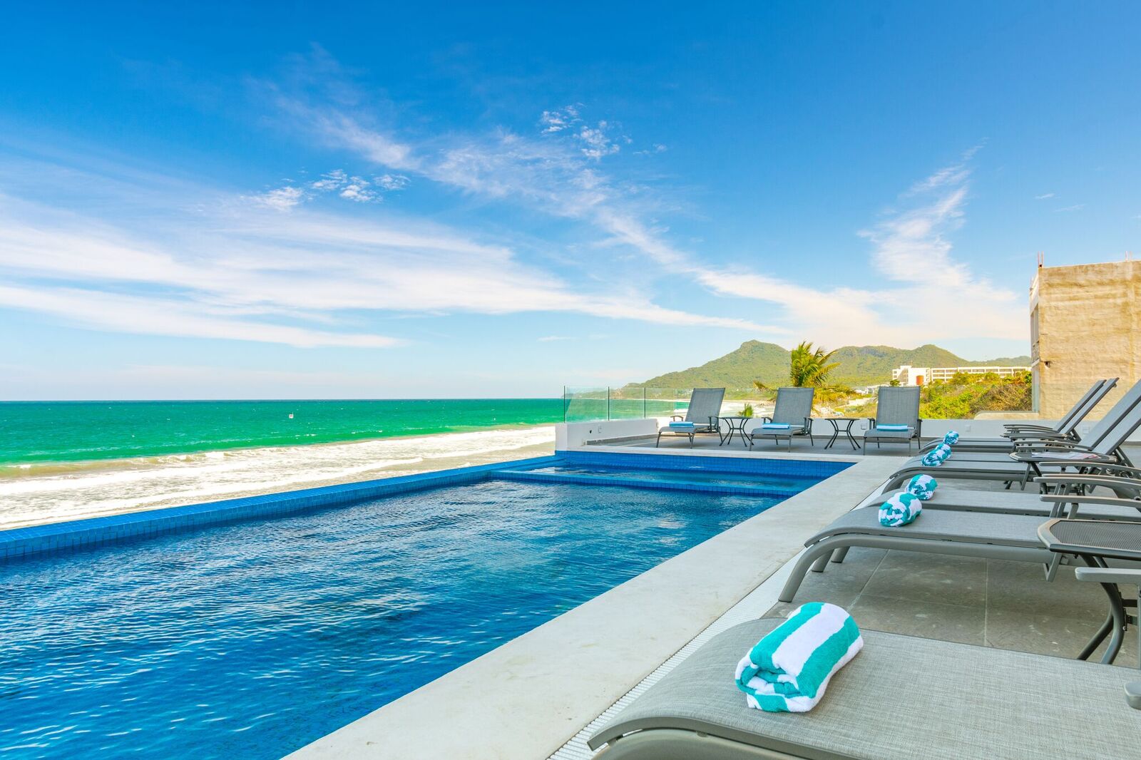 Torre Marsai pool with sun loungers and ocean view