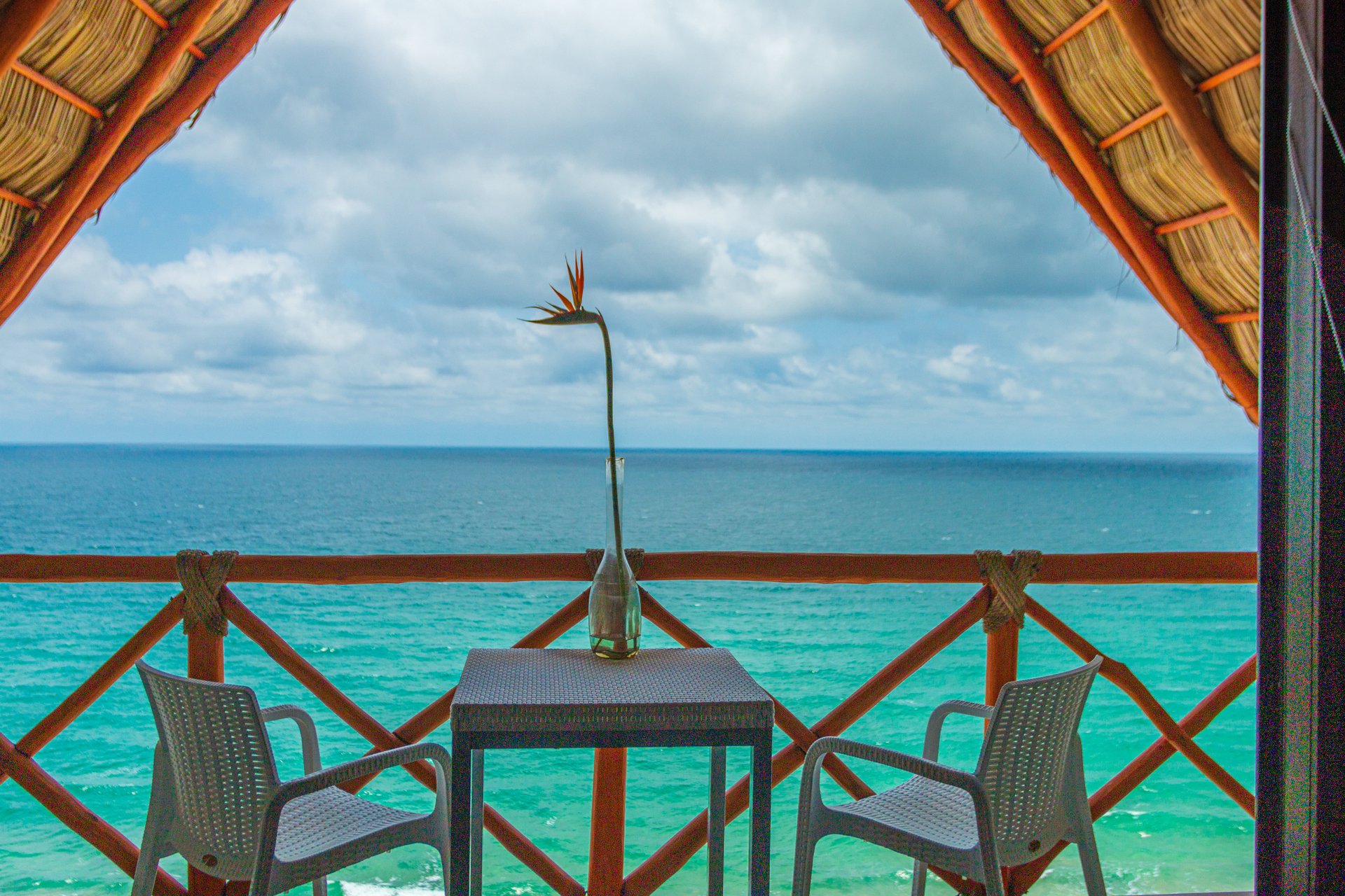 Terrace with a palapa and ocean view at Torre Marsai